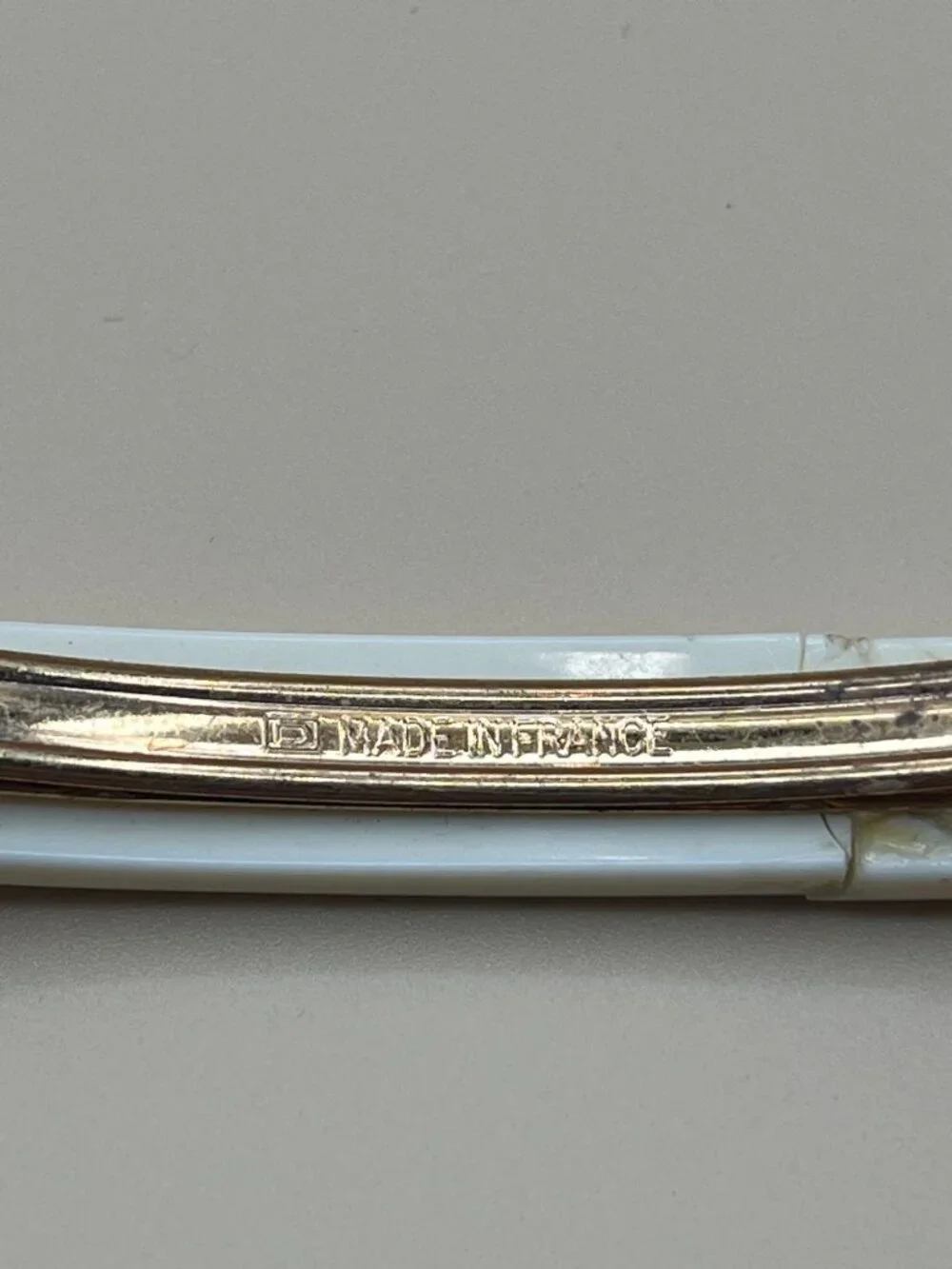 Authentic vintage Chanel bar barrette in cream-white resin, printed with two red